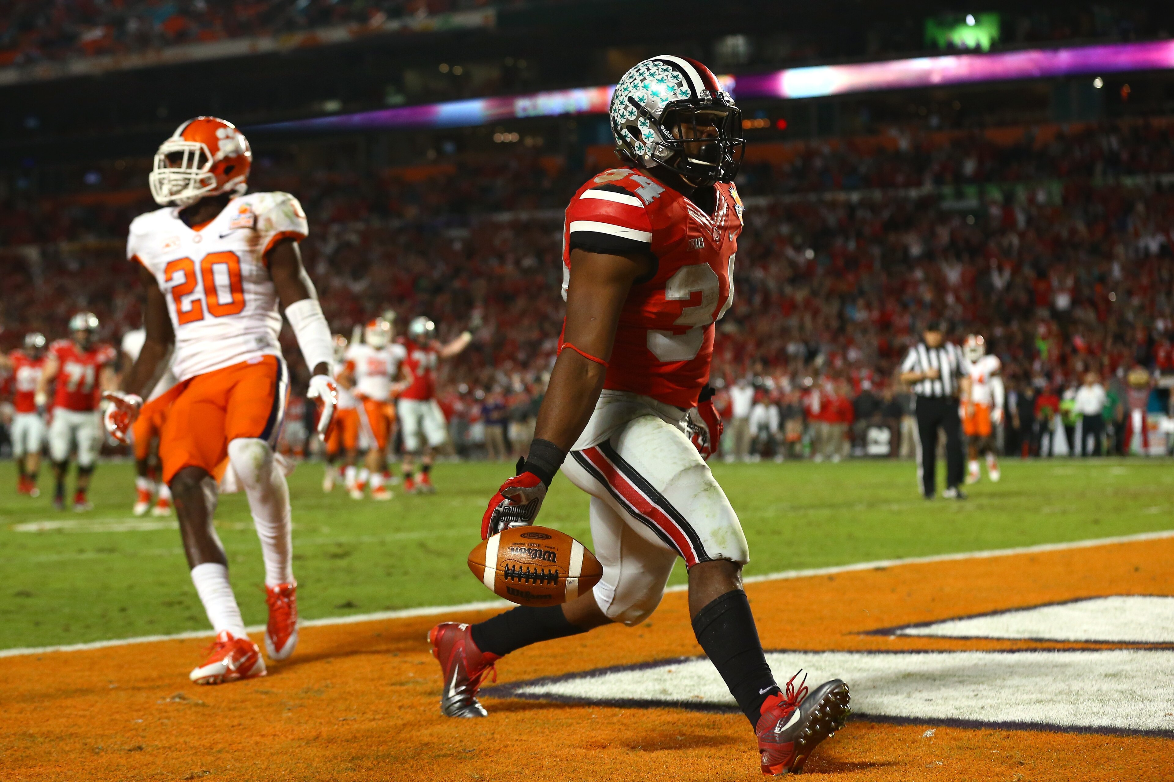 MIAMI GARDENS, FL - JANUARY 03: Carlos Hyde #34 of the Ohio State Buckeyes scores a touchdown in the fourth quarter against the Clemson Tigers during the Discover Orange Bowl at Sun Life Stadium on January 3, 2014 in Miami Gardens, Florida.  (Photo by Streeter Lecka/Getty Images)