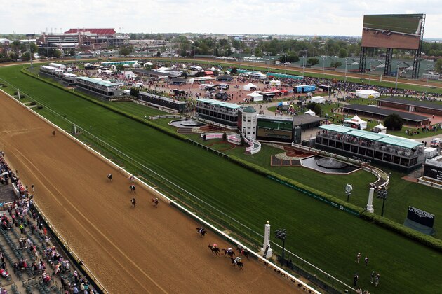 LOUISVILLE, KY - MAY 02:  Tiz Windy #2 leads Handmade #1 and Flipcup #3 across the finish line to win the 3rd race ahead of the 140th Kentucky Oaks at Churchill Downs on May 2, 2014 in Louisville, Kentucky.  (Photo by Jamie Squire/Getty Images)