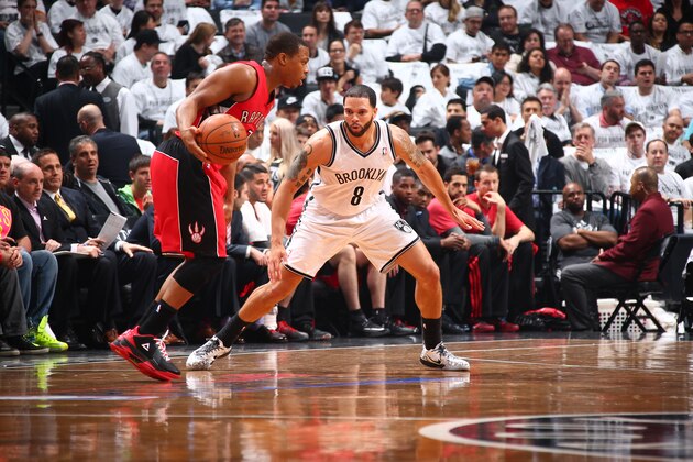 BROOKLYN, NY - MAY 2: Deron Williams #8 of the Brooklyn Nets plays tight defense against Kyle Lowry #7 of the Toronto Raptors during Game Six of the Eastern Conference Quarterfinals at Barclays Center on May 2, 2014 in the Brooklyn borough of New York City.  NOTE TO USER: User expressly acknowledges and agrees that, by downloading and/or using this Photograph, user is consenting to the terms and conditions of the Getty Images License Agreement. Mandatory Copyright Notice: Copyright 2014 NBAE (Photo by Nathaniel S. Butler/NBAE via Getty Images)