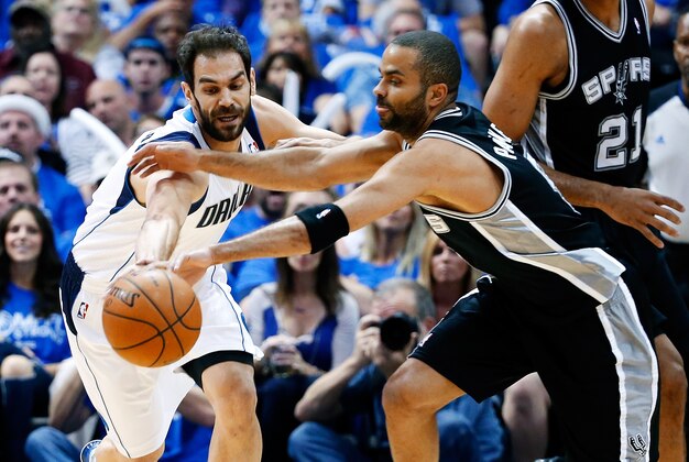 May 2, 2014; Dallas, TX, USA; Dallas Mavericks guard Jose Calderon (8) and San Antonio Spurs guard Tony Parker (9) battle for a loose ball during the first quarter in game six of the first round of the 2014 NBA Playoffs at American Airlines Center. Mandatory Credit: Kevin Jairaj-USA TODAY Sports