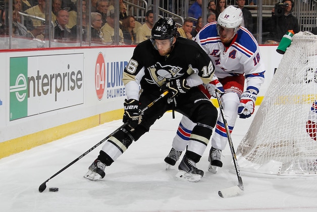 PITTSBURGH, PA - MAY 2:  Brandon Sutter #16 of the Pittsburgh Penguins moves the puck in front of Marc Staal #18 of the New York Rangers in Game One of the Second Round of the 2014 Stanley Cup Playoffs at Consol Energy Center on May 2, 2014 in Pittsburgh, Pennsylvania.  (Photo by Gregory Shamus/NHLI via Getty Images)
