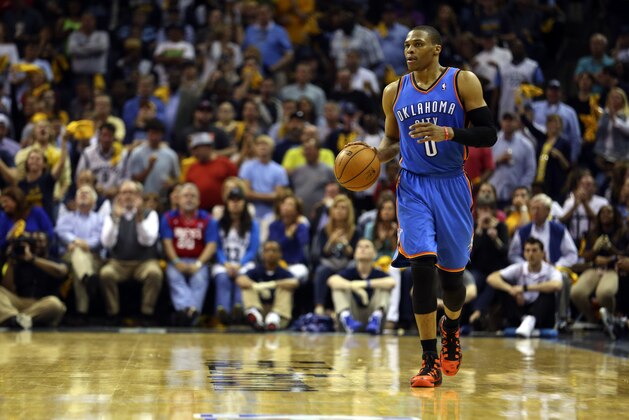 May 1, 2014; Memphis, TN, USA; Oklahoma City Thunder guard Russell Westbrook (0) brings the ball up court during the game against the Memphis Grizzlies in game six of the first round of the 2014 NBA Playoffs at FedExForum.  The Oklahoma City Thunder defeated the Memphis Grizzlies 104-84.   Mandatory Credit: Spruce Derden-USA TODAY Sports