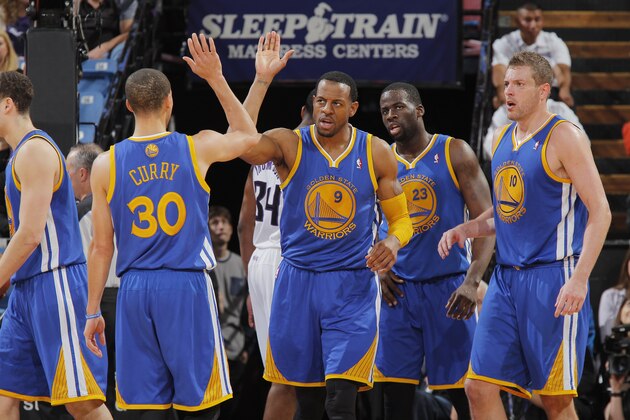 SACRAMENTO, CA - FEBRUARY 19: Andre Iguodala #9 of the Golden State Warriors high fives teammate Stephen Curry #30 during the game against the Sacramento Kings on February 19, 2014 at Sleep Train Arena in Sacramento, California. NOTE TO USER: User expressly acknowledges and agrees that, by downloading and or using this photograph, User is consenting to the terms and conditions of the Getty Images Agreement. Mandatory Copyright Notice: Copyright 2014 NBAE (Photo by Rocky Widner/NBAE via Getty Images)