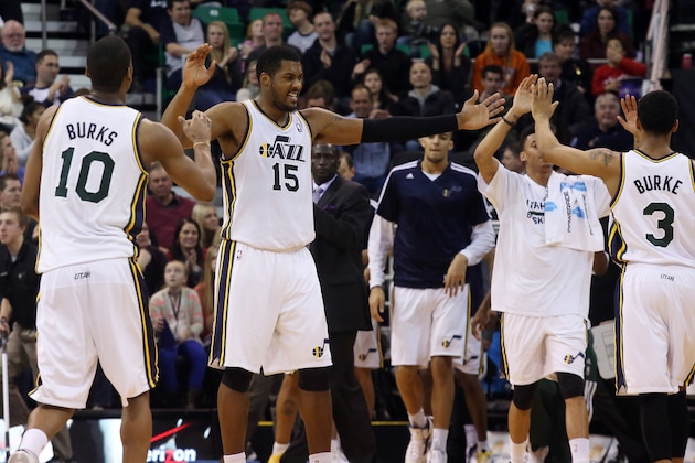 Utah Jazz's Alec Burks (10), Utah Jazz's Derrick Favors (15) and Utah Jazz's Trey Burke (3) celebrate leading the Milwaukee Bucks in the second half of an NBA basketball game Thursday, Jan. 2, 2014, in Salt Lake City.  The Jazz won 96-87. (AP Photo/Kim Raff)