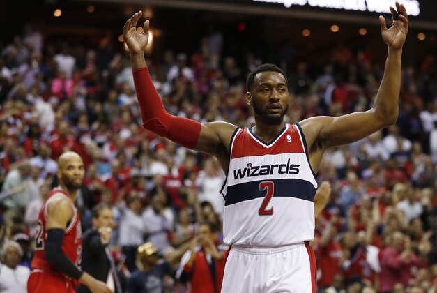 Apr 27, 2014; Washington, DC, USA; Washington Wizards guard John Wall (2) celebrates on the court against the Chicago Bulls in the closing second of the fourth quarter in game four of the first round of the 2014 NBA Playoffs at Verizon Center. The Wizards won 98-89. Mandatory Credit: Geoff Burke-USA TODAY Sports