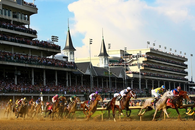 LOUISVILLE, KY - MAY 05:   Mario Gutierrez seen in purple silks atop I'll Have Another (4th R) and the field take the first turn during the 138th running of the Kentucky Derby at Churchill Downs on May 5, 2012 in Louisville, Kentucky.  (Photo by Elsa/Getty Images)