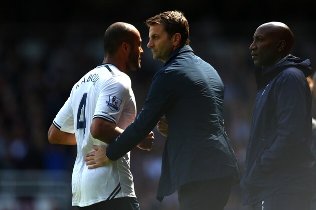 LONDON, ENGLAND - MAY 03:  Tim Sherwood the Spurs manager consoles Younes Kaboul of Spurs after he receives an early red card during the Barclays Premier League match between West Ham United and Tottenham Hotspur at Boleyn Ground on May 3, 2014 in London, England.  (Photo by Paul Gilham/Getty Images)