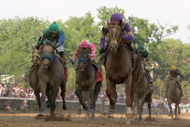 LOUISVILLE, KY - MAY 05:  I'll Have Another ridden by Mario Gutierrez leads the pack down the final stretch during the 138th running of the Kentucky Derby ahead of at Churchill Downs on May 5, 2012 in Louisville, Kentucky.  (Photo by Matthew Stockman/Getty Images)