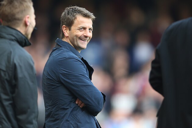 Tottenham's manager Tim Sherwood smiles as he watches his team play from the technical area during their English Premier League soccer match between West Ham United and Tottenham Hotspur at the Boleyn stadium in London Saturday, May  3  2014. (AP Photo/Alastair Grant)