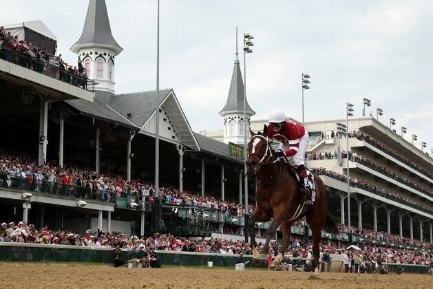 LOUISVILLE, KY - MAY 02:  Untapable #13, ridden by Rosie Napravnik, crosses the finish line to win the 140th running of the Kentucky Oaks at Churchill Downs on May 2, 2014 in Louisville, Kentucky.  (Photo by Rob Carr/Getty Images)