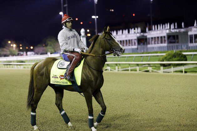 Exercise rider William Delgado takes Kentucky Derby entrant California Chrome for a morning workout during a morning workout at Churchill Downs Friday, May 2, 2014, in Louisville, Ky. (AP Photo/Morry Gash)