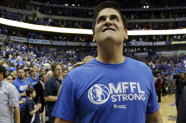 Dallas Mavericks team owner Mark Cuban walks off the floor following their 113-111 win over the San Antonio Spurs in Game 6 of an NBA basketball first-round playoff series, Friday, May 2, 2014, in Dallas. (AP Photo/Tony Gutierrez)