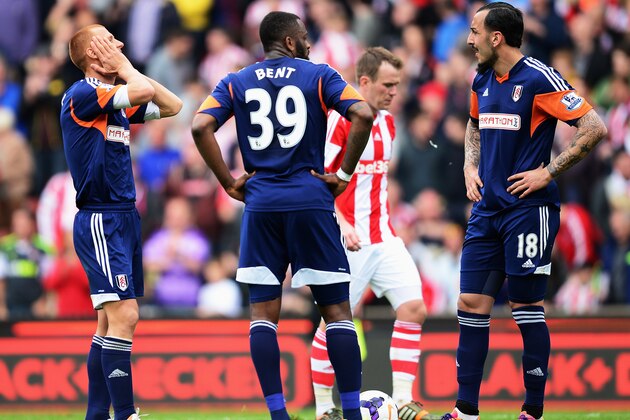 STOKE ON TRENT, ENGLAND - MAY 03:  (L-R) Steve Sidwell, Darren Bent and Konstantinos Mitroglou of Fulham react as their side concedes a third goal during the Barclays Premier League match between Stoke City and Fulham at the Britannia Stadium on May 3, 2014 in Stoke on Trent, England.  (Photo by Jamie McDonald/Getty Images)