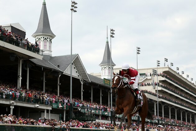 LOUISVILLE, KY - MAY 02:  Untapable #13, ridden by Rosie Napravnik, crosses the finish line to win the 140th running of the Kentucky Oaks at Churchill Downs on May 2, 2014 in Louisville, Kentucky.  (Photo by Rob Carr/Getty Images)