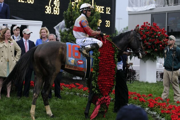May 4, 2013; Louisville, KY, USA; Joel Rosario aboard Orb (16) is led to the winner's circle after winning the 2013 Kentucky Derby at Churchill Downs. Mandatory Credit: Jamie Rhodes-USA TODAY Sports