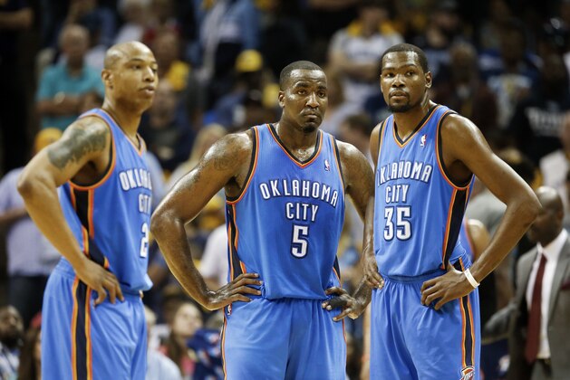 Oklahoma City Thunder players Caron Butler (2), Kendrick Perkins (5) and Kevin Durant (35) wait for play to resume in the second half of Game 6 of an opening-round NBA basketball playoff series against the Memphis Grizzlies Thursday, May 1, 2014, in Memphis, Tenn. Oklahoma City won 104-84 to even the series 3-3. (AP Photo/Mark Humphrey)
