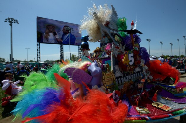 LOUISVILLE, KY - MAY 03:  A race fan wearing a festive hat looks on from the infield prior to the 140th running of the Kentucky Derby at Churchill Downs on May 3, 2014 in Louisville, Kentucky.  (Photo by Dylan Buell/Getty Images)