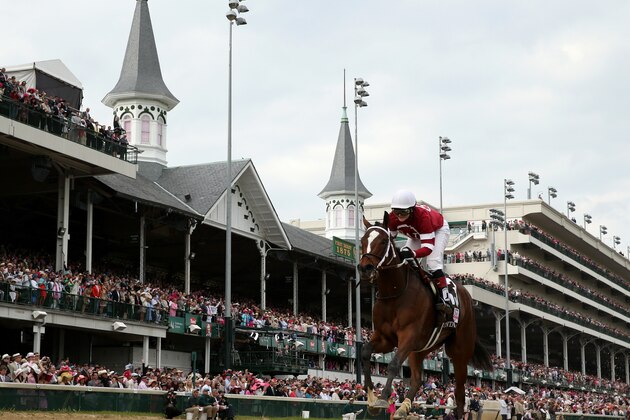 LOUISVILLE, KY - MAY 02:  Untapable #13, ridden by Rosie Napravnik, crosses the finish line to win the 140th running of the Kentucky Oaks at Churchill Downs on May 2, 2014 in Louisville, Kentucky.  (Photo by Rob Carr/Getty Images)