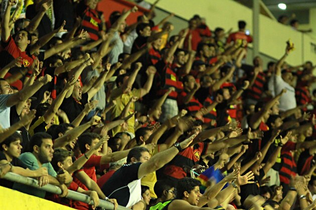 RECIFE, BRAZIL - APRIL 27: Fans of Sport Recife cheer before a match between Sport Recife and Chapecoense as part of Brasileirao Series A 2014 at Ilha do Retiro Stadium on April 27, 2014 in Recife, Brazil. (Photo by Renato Spencer/Getty Images)