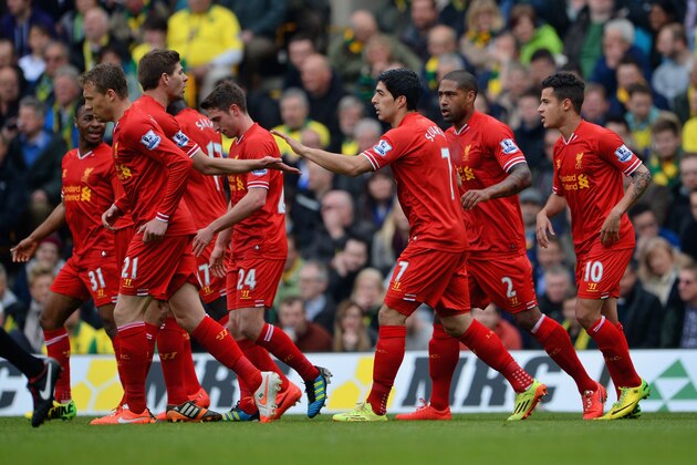NORWICH, ENGLAND - APRIL 20: Steven Gerrard of Liverpool congratulates Luis Suarez of Liverpool on scoring their second goal during the Barclays Premier League match between Norwich City and Liverpool at Carrow Road on April 20, 2014 in Norwich, England.  (Photo by Michael Regan/Getty Images)