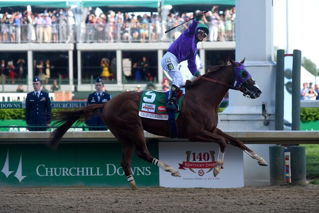 LOUISVILLE, KY - MAY 03:  California Chrome #5, ridden by Victor Espinoza, crosses the finish line to win the 140th running of the Kentucky Derby at Churchill Downs on May 3, 2014 in Louisville, Kentucky.  (Photo by Dylan Buell/Getty Images)