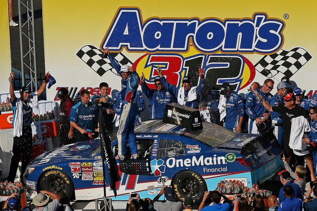 TALLADEGA, AL - MAY 03:  Elliott Sadler, driver of the #11 OneMain Financial Toyota, celebrates in Victory Lane after winning the NASCAR Nationwide Series Aaron's 312 at Talladega Superspeedway on May 3, 2014 in Talladega, Alabama.  (Photo by Mike Ehrmann/Getty Images)