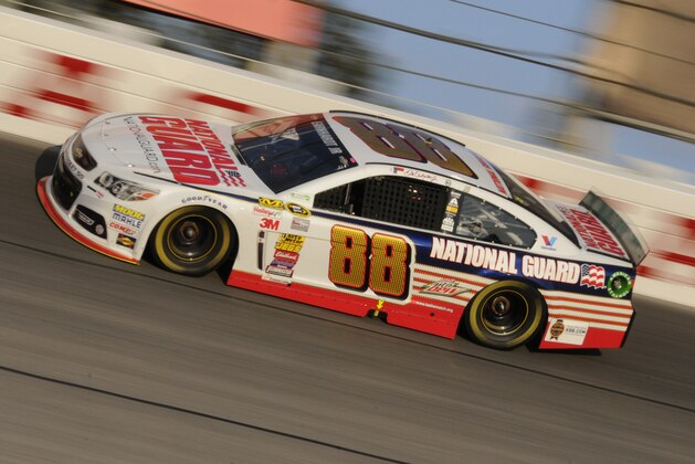 Dale Earnhardt Jr (88) drives his car during a NASCAR Sprint Cup series auto race at Darlington Raceway in Darlington, S.C., Saturday, April 12, 2014. (AP Photo/Mike McCarn)
