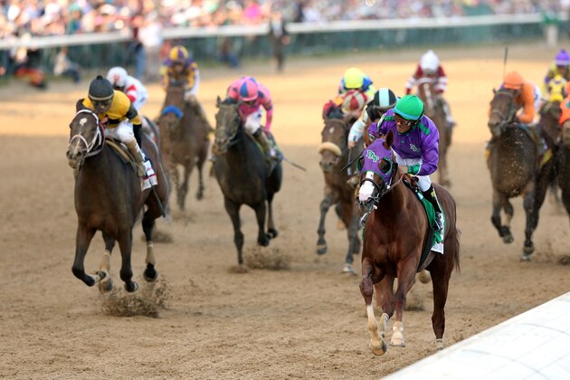 LOUISVILLE, KY - MAY 03:  California Chrome #5, ridden by Victor Espinoza, comes to the finish line to win the 140th running of the Kentucky Derby at Churchill Downs on May 3, 2014 in Louisville, Kentucky.  (Photo by Matthew Stockman/Getty Images)