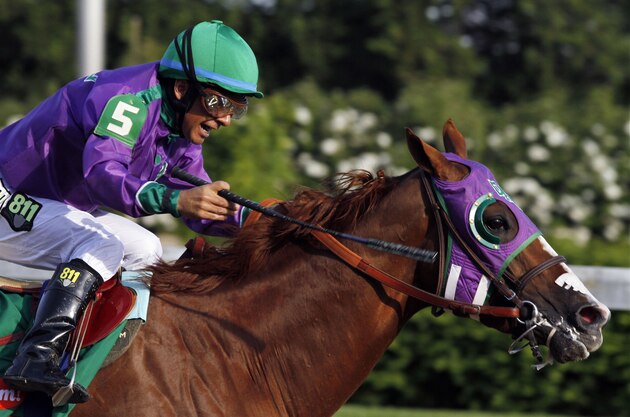 Victor Espinoza rides California Chrome to a victory during the 140th running of the Kentucky Derby horse race at Churchill Downs Saturday, May 3, 2014, in Louisville, Ky. (AP Photo/Garry Jones)