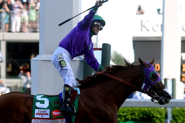 LOUISVILLE, KY - MAY 03:  Jockey Victor Espinoza celebrates atop of California Chrome #5 after crossing the finish line to win the 140th running of the Kentucky Derby at Churchill Downs on May 3, 2014 in Louisville, Kentucky.  (Photo by Dylan Buell/Getty Images)