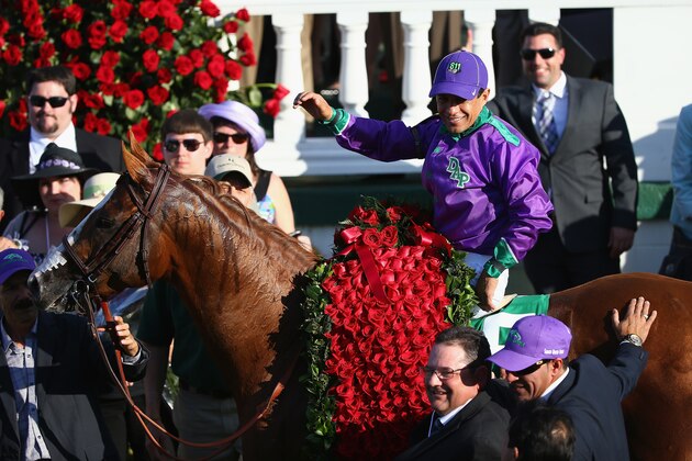 LOUISVILLE, KY - MAY 03:  Victor Espinoza celebrates  in the winners circle after riding California Chrome #5 to victory in the 140th running of the Kentucky Derby at Churchill Downs on May 3, 2014 in Louisville, Kentucky.  (Photo by Andy Lyons/Getty Images)