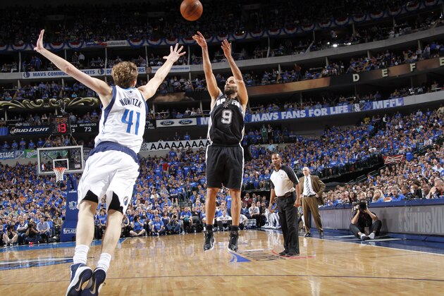 DALLAS, TX - MAY 2: Tony Parker #9 of the San Antonio Spurs shoots a jumper against Dirk Nowitzki #41 of the Dallas Mavericks in Game Six of the Western Conference Quarterfinals during the 2014 NBA Playoffs on May 2, 2014 at the American Airlines Center in Dallas, Texas. NOTE TO USER: User expressly acknowledges and agrees that, by downloading and/or using this Photograph, user is consenting to the terms and conditions of the Getty Images License Agreement. Mandatory Copyright Notice: Copyright 2014 NBAE (Photo by Glenn James/NBAE via Getty Images)
