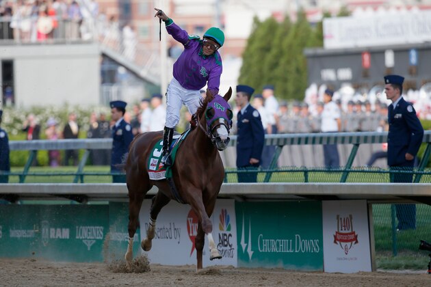 LOUISVILLE, KY - MAY 03:  Jockey Victor Espinoza celebrates atop of California Chrome #5 after crossing the finish line to win the 140th running of the Kentucky Derby at Churchill Downs on May 3, 2014 in Louisville, Kentucky.  (Photo by Kevin C. Cox/Getty Images)