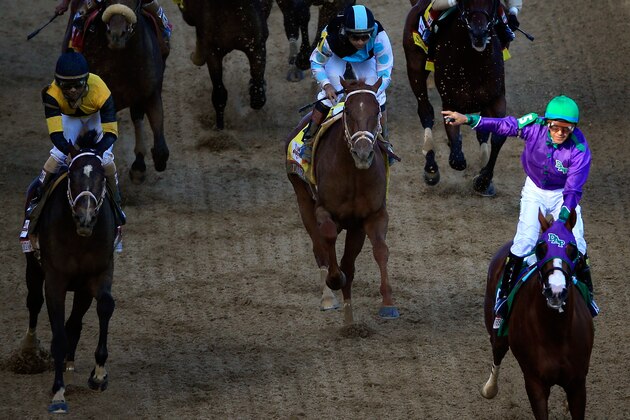 LOUISVILLE, KY - MAY 03:  California Chrome with Victor Espinoza up crosses the finish line to win the 140th running of the Kentucky Derby at Churchill Downs on May 3, 2014 in Louisville, Kentucky.  (Photo by Jamie Squire/Getty Images)