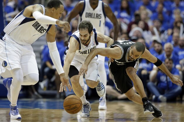 Dallas Mavericks' Shawn Marion, left, and Jose Calderon, center, of Spain, chase after the ball against San Antonio Spurs' Tony Parker, right, of France, in the first half of Game 6 of an NBA basketball first-round playoff series on Friday, May 2, 2014, in Dallas. (AP Photo/Tony Gutierrez)