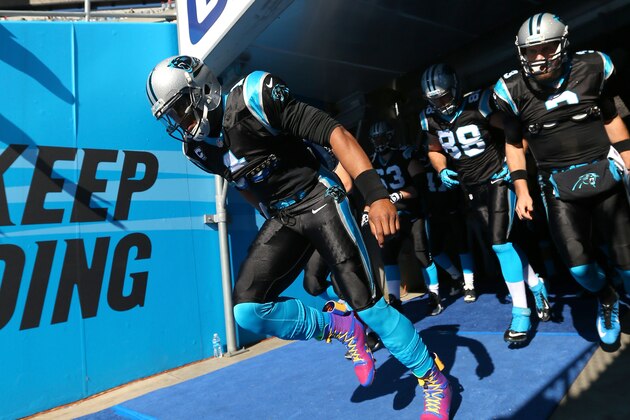 CHARLOTTE, NC - JANUARY 12:  Cam Newton #1 of the Carolina Panthers leads the team out of the tunnel prior to the NFC Divisional Playoff Game against the San Francisco 49ers at Bank of America Stadium on January 12, 2014 in Charlotte, North Carolina.  (Photo by Ronald Martinez/Getty Images)