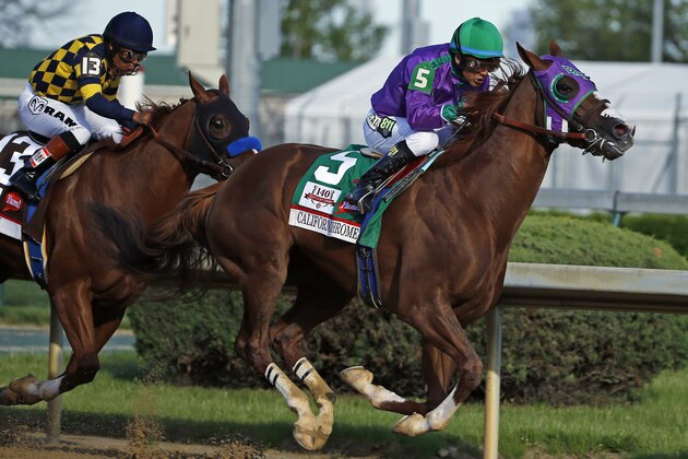 Victor Espinoza rides California Chrome to a victory during the 140th running of the Kentucky Derby horse race at Churchill Downs Saturday, May 3, 2014, in Louisville, Ky. (AP Photo/Matt Slocum)