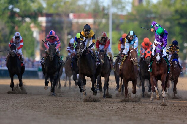 LOUISVILLE, KY - MAY 03:  Jockey Victor Espinoza celebrates atop of California Chrome #5 after crossing the finish line to win the 140th running of the Kentucky Derby at Churchill Downs on May 3, 2014 in Louisville, Kentucky.  (Photo by Rob Carr/Getty Images)