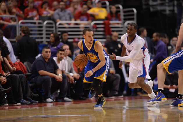 LOS ANGELES, CA - MAY 3: Stephen Curry #30 of the Golden State Warriors handles the ball against Chris Paul #3 of the Los Angeles Clippers in Game Seven of the Western Conference Quarterfinals during the 2014 NBA Playoffs at Staples Center on May 3, 2014 in Los Angeles, California. NOTE TO USER: User expressly acknowledges and agrees that, by downloading and/or using this Photograph, user is consenting to the terms and conditions of the Getty Images License Agreement. Mandatory Copyright Notice: Copyright 2014 NBAE (Photo by Noah Graham/NBAE via Getty Images)