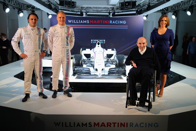 LONDON, ENGLAND - MARCH 06:  Valtteri Bottas, Valtteri Bottas, Sir Frank Williams and Claire Williams pose with the Williams Martini Racing formula one car on March 6, 2014 in London, England.  (Photo by Clive Rose/Getty Images)