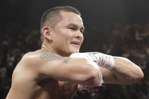 Marcos Maidana, from Argentina, celebrates at the end of his WBC-WBA welterweight title boxing fight against Floyd Mayweather Jr., Saturday, May 3, 2014, in Las Vegas.  Mayweather won the bout by majority decision. (AP Photo/Isaac Brekken)
