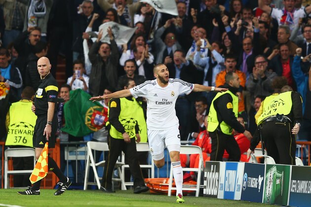 MADRID, SPAIN - APRIL 23:  Karim Benzema of Real Madrid celebrates scoring the opening goal during the UEFA Champions League semi-final first leg match between Real Madrid and FC Bayern Muenchen at the Estadio Santiago Bernabeu on April 23, 2014 in Madrid, Spain.  (Photo by Paul Gilham/Getty Images)