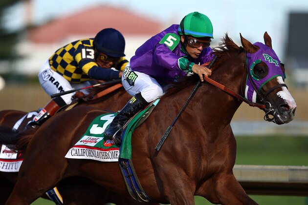 LOUISVILLE, KY - MAY 03:  California Chrome #5, ridden by Victor Espinoza, comes out of the fourth turn enroute to winning the 140th running of the Kentucky Derby at Churchill Downs on May 3, 2014 in Louisville, Kentucky.  (Photo by Andy Lyons/Getty Images)