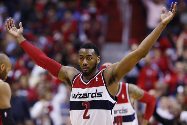 Washington Wizards guard John Wall (2) reacts to a call during the second half of game 4 of an opening-round NBA basketball playoff series in Washington, Sunday, April 27, 2014. (AP Photo/Alex Brandon)