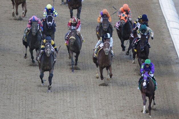 Victor Espinoza, front right, rides California Chrome to victory during the 140th running of the Kentucky Derby horse race at Churchill Downs Saturday, May 3, 2014, in Louisville, Ky.  (AP Photo/Charlie Riedel)