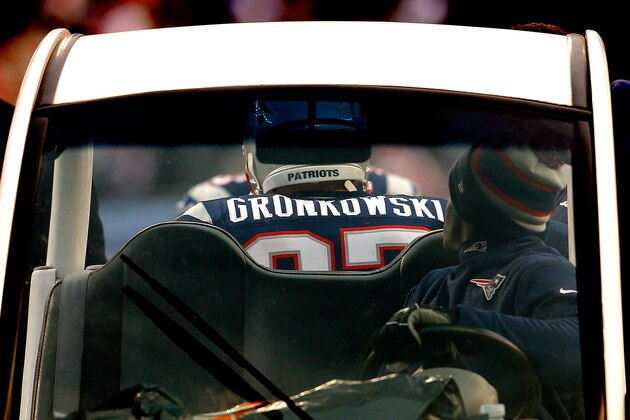 FOXBORO, MA - DECEMBER 8: Rob Gronkowski #87 of the New England Patriots is taken off of the field after an injury against the Cleveland Browns at Gillette Stadium on December 8, 2013 in Foxboro, Massachusetts. (Photo by Jim Rogash/Getty Images)