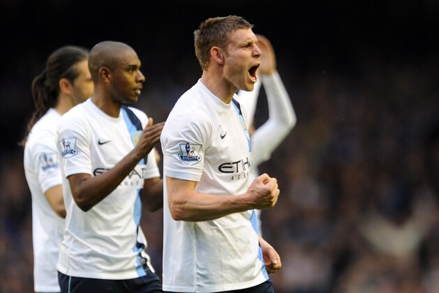 Manchester City's James Milner celebrates his side's victory after the final whistle during their English Premier League soccer match against Everton at Goodison Park in Liverpool, England, Saturday May 3, 2014. (AP Photo/Clint Hughes)