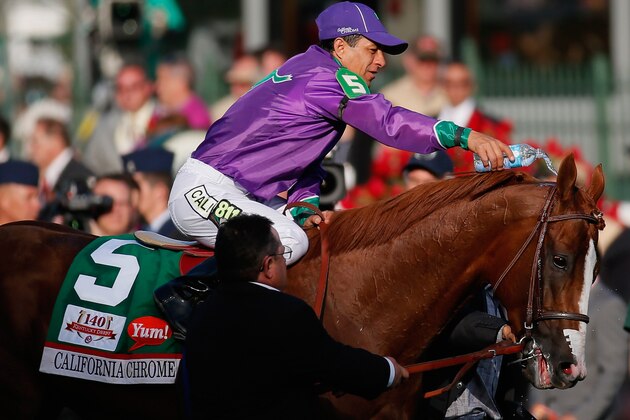 LOUISVILLE, KY - MAY 03:  Jockey Victor Espinoza cools down California Chrome #5 on the way to the winners circle after winning the 140th running of the Kentucky Derby at Churchill Downs on May 3, 2014 in Louisville, Kentucky.  (Photo by Kevin C. Cox/Getty Images)