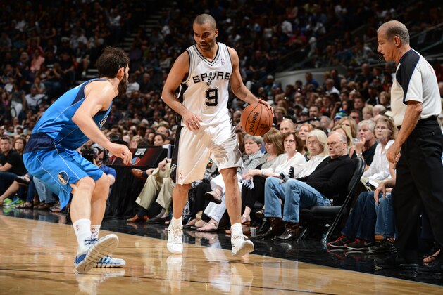SAN ANTONIO, TX - MAY 4: Tony Parker #9 of the San Antonio Spurs dribbles up the court against the Dallas Mavericks in Game Seven of the Western Conference Quarterfinals during the 2014 NBA Playoffs on MAY 4, 2014 at the AT&T Center in San Antonio, Texas. NOTE TO USER: User expressly acknowledges and agrees that, by downloading and/or using this Photograph, user is consenting to the terms and conditions of the Getty Images License Agreement. Mandatory Copyright Notice: Copyright 2014 NBAE (Photo by Garrett W. Ellwood/NBAE via Getty Images)