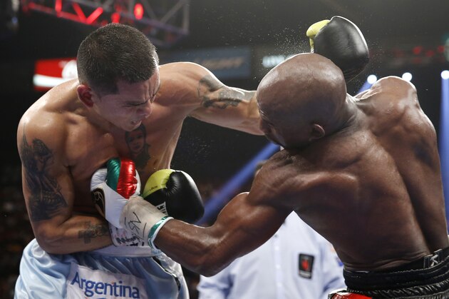Marcos Maidana, left, from Argentina, and Floyd Mayweather Jr. brawl late in their WBC-WBA welterweight title boxing fight Saturday, May 3, 2014, in Las Vegas. Mayweather won the bout by majority decision. (AP Photo/Eric Jamison) Marcos Maidana, left, from Argentina, and Floyd Mayweather Jr. brawl late in their WBC-WBA welterweight title boxing fight Saturday, May 3, 2014, in Las Vegas. Mayweather won the bout by majority decision. (AP Photo/Eric Jamison)